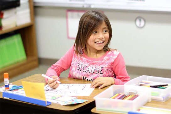 smiling girl in a classroom